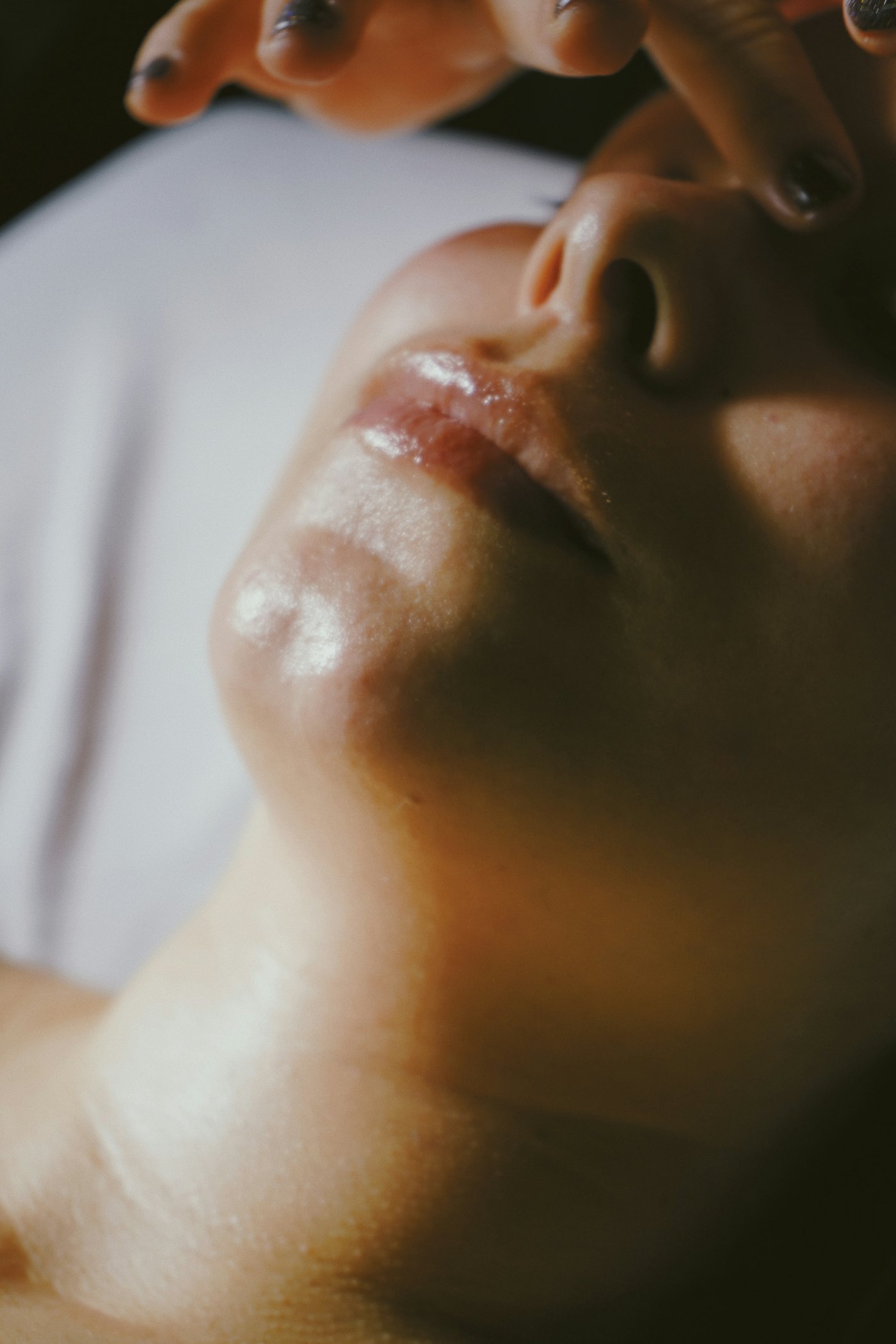 Close-up of a client relaxing during a facial